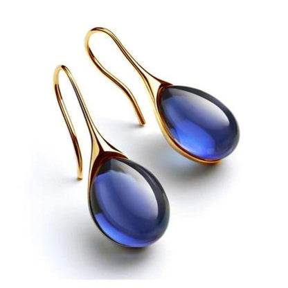 Élégantes boucles d'oreilles pendantes ornées de cristaux